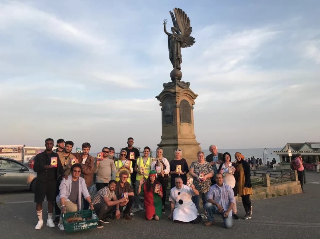 Deen Relief volunteers gathered at Brighton seafront for a community outreach event