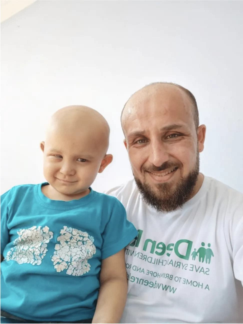 Deen Relief team member with a child undergoing cancer treatment